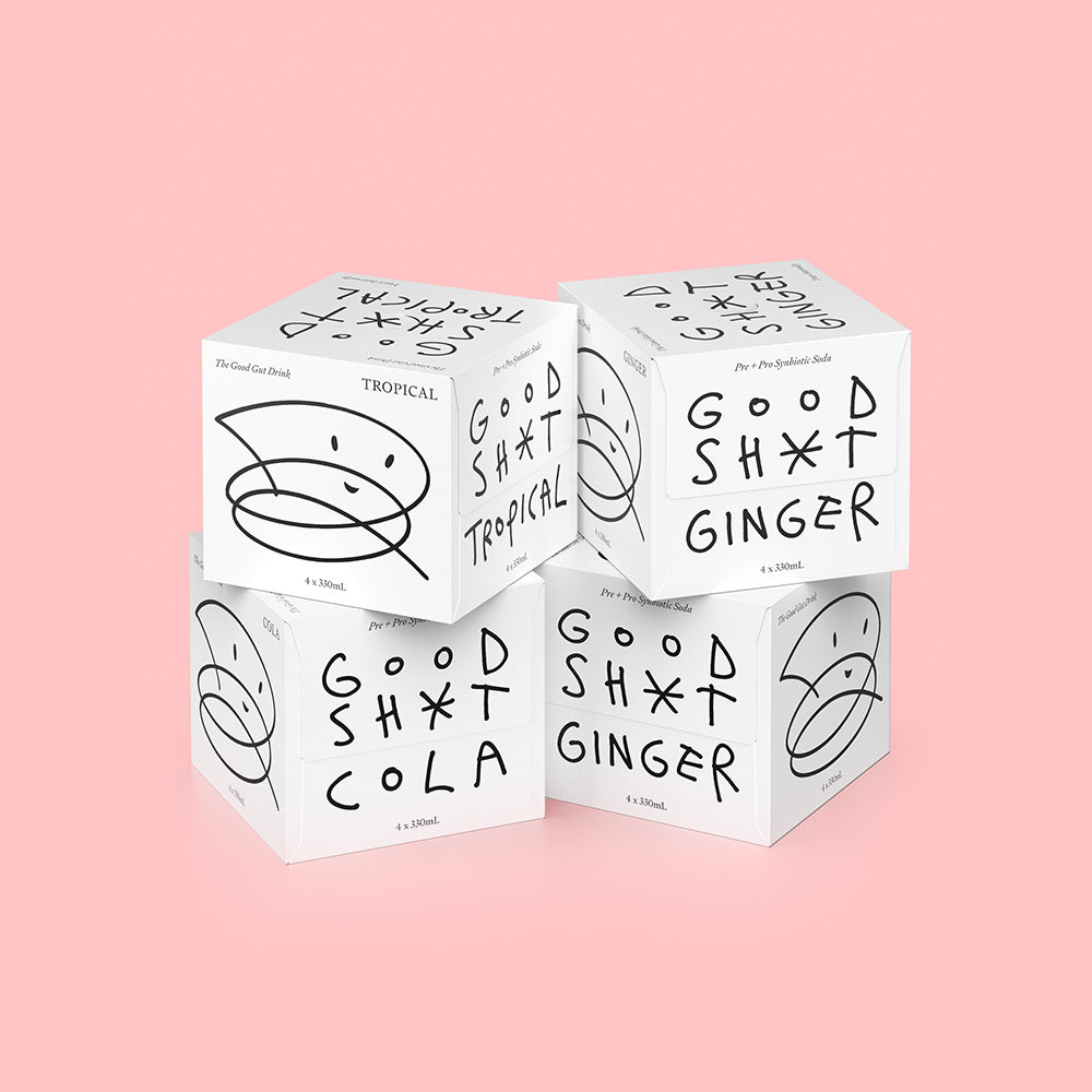 Four 'Good Shot' drink boxes stacked on a pink background